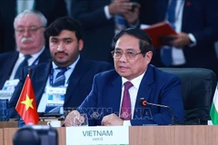 范明政在题为“加强多边主义、经济金融问题及人工智能”的高级别讨论会上发表重要讲话。图自越通社