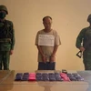 被抓获的嫌疑人Xải Khư Lỳ。图自越通社