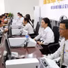 职能机构为企业和人民解决行政手续。图自越通社