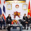 苏林总书记、国家主席会见泰国国会主席梭蓬·乍兰。图自越通社