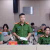 反腐败和经济犯罪调查警察局（C03）副局长武清松中校回答新闻媒体机构记者的提问。图自越通社