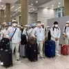 越南工人入境韩国仁川机场。图自越通社