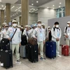 越南工人入境韩国仁川机场。图自越通社