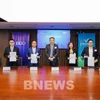 VinFast、V-Green、GSM与BDO银行的代表共同签署合作备忘录。图自越通社