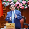 范明政在会上发表讲话。图自越通社