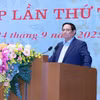范明政在会上发表讲话。图自越通社