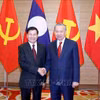 越共中央总书记苏林与老挝人民革命党中央总书记、国家主席通伦·西苏里合影。图自越通社