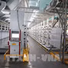 Unitex 染整纺织有限公司的纺纱厂采用新技术，按照自动化模式优化生产运营。图自越通社