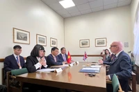 工作会议现场。图自越通社