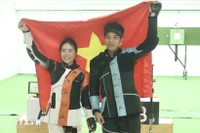 越南射击选手黎氏梦泉与阮心光。图自越通社