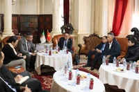 工作会议现场。图自越通社