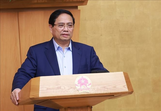 政府总理范明政主持召开政府9月份例行会议。图自越通社