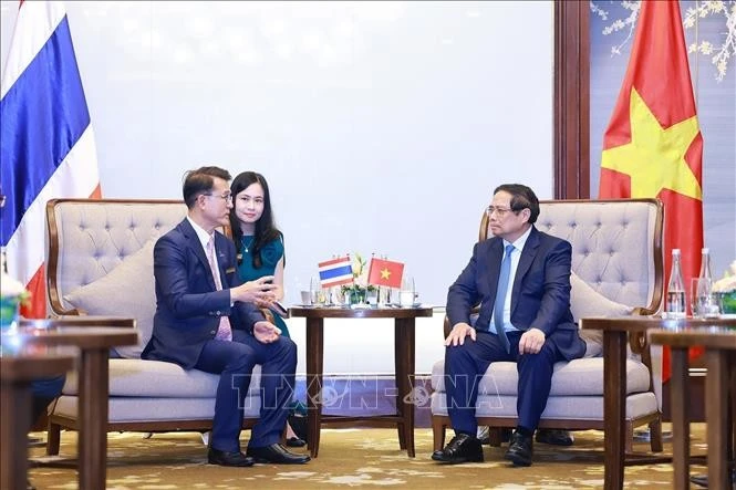 范明政总理会见开泰银行董事长钟拉·拉塔纳皮安。图自越通社