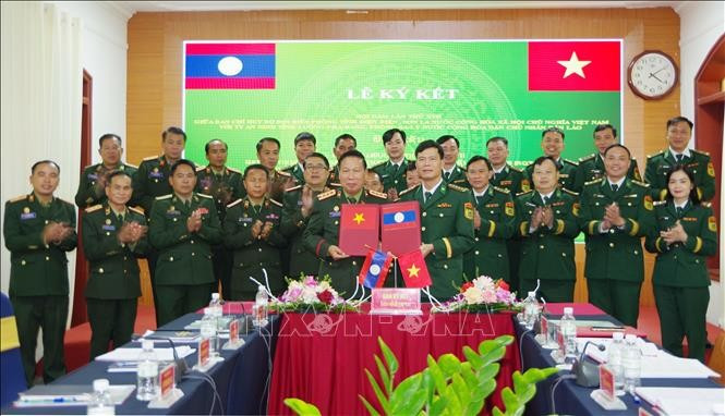 奠边省委宣教与民运部与老挝丰沙里、乌多姆赛、琅勃拉邦三省宣教部合作谅解备忘录交换仪式。图自越通社