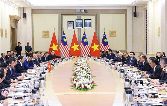 越南政府总理范明政与马来西亚总理易卜拉欣举行会谈。图自越通社