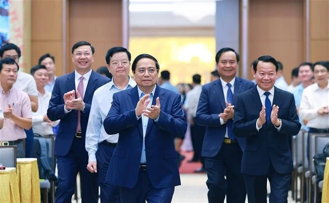 越南政府总理范明政主持新农村建设与扶贫工作全国视频会议。图自越通社
