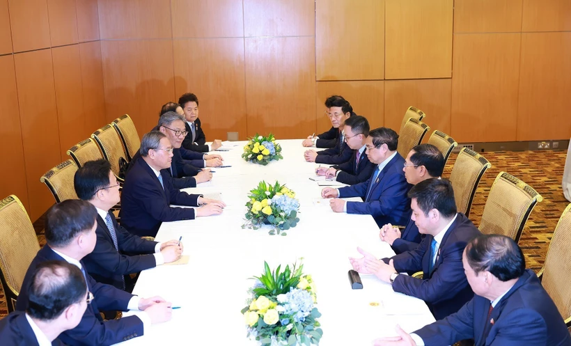 越南政府总理范明政与中国国务院总理李强举行会谈。图自越通社