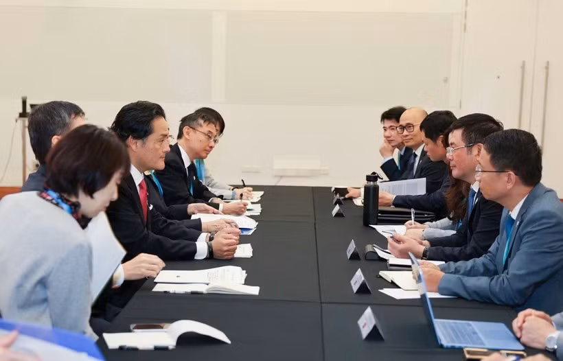 双方会晤现场。图自越通社
