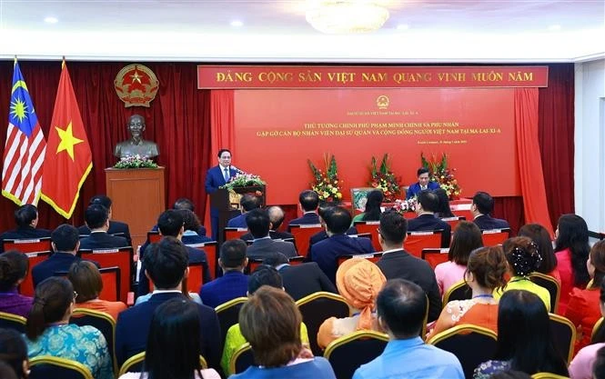 范明政总理在见面会上发言。图自越通社