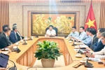 工作会谈场景。图自越通社