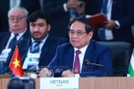 范明政在题为“加强多边主义、经济金融问题及人工智能”的高级别讨论会上发表重要讲话。图自越通社