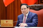 越南政府总理范明政主持召开政府常务会议。图自越通社