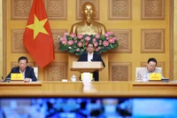 范明政在国家重点交通工程项目指导委员会第22次会议上发表讲话。图自越通社