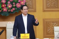 政府总理范明政在会上发言。图自越通社