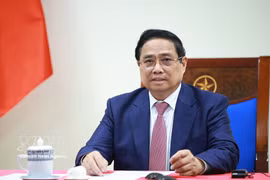 越南政府总理范明政与安哥拉总统洛伦索通电话 。图自越通社
