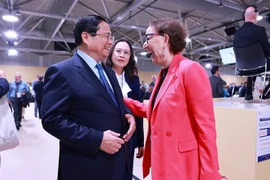 范明政与联合国贸易和发展会议秘书长丽贝卡·格林斯潘。图自越通社