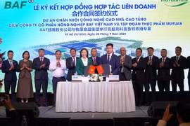 越南BAF农业股份公司与中国牧原食品集团合作合同签约仪式。图自越通社