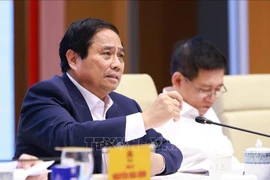 越南总理范明政在会议上发表讲话。图自越通社