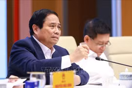 越南总理范明政在会议上发表讲话。图自越通社