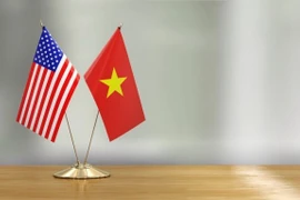 越美两国国旗。图自越通社