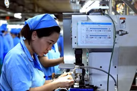 富寿省（原和平省）沱江左岸工业区半导体线材生产线。图自越通社
