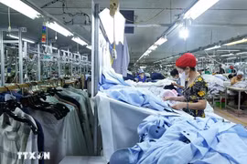 一家服装出口公司。图自越通社
