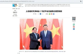 新华社刊登有关中国国家主席习近平会见越南政府总理范明政的文章。（屏幕截图）
