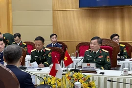 越南国防部副部长黄春战上将在对话上发表讲话。图自越通社