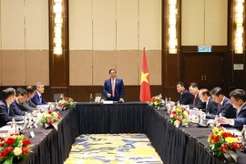 会议场景。图自越通社