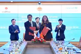 签字仪式现场。图自越通社