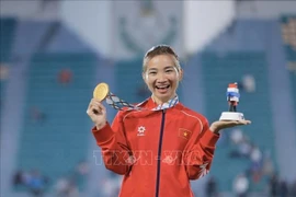 田径运动员阮氏莺夺得本届东南亚运动会第三枚金牌。图自越通社