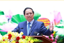 范明政总理在会上发表讲话。图自越通社