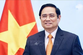 政府总理范明政。图自越通社