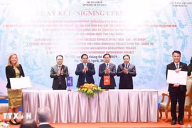 签署仪式场景。图自越通社