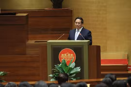 越南政府总理范明政在会上发表讲话。图自越通社
