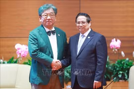 越南政府总理范明政会见全球绿色增长研究所总干事金相浃。图自越通社