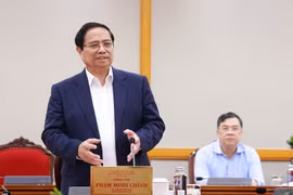 范明政总理在会上发表讲话。图自越通社