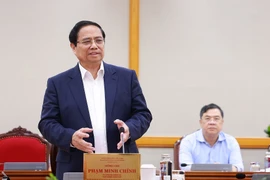 范明政总理在会上发表讲话。图自越通社