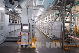 Unitex 染整纺织有限公司的纺纱厂采用新技术，按照自动化模式优化生产运营。图自越通社