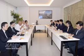 工作会谈现场。图自越通社